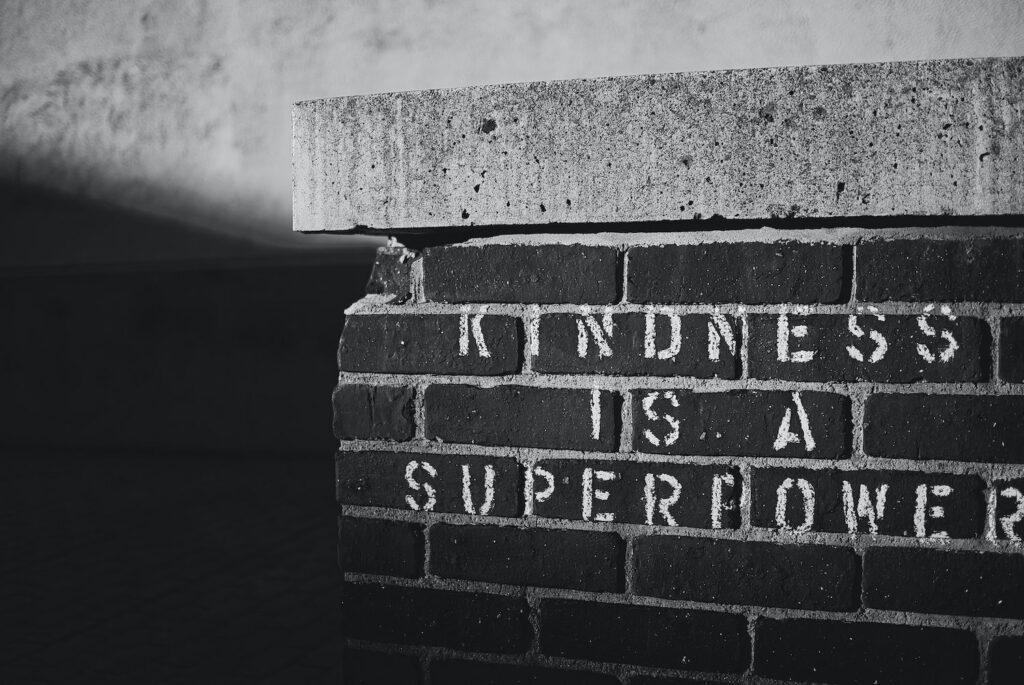 kindness is a superpower written on brick wall